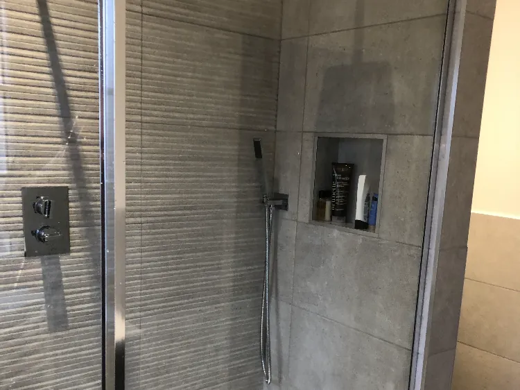 Refitted shower room with tiled walls